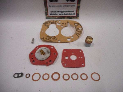 Reparatieset carburateur met pakkingen en onderdelen voor carburateurreparatie.