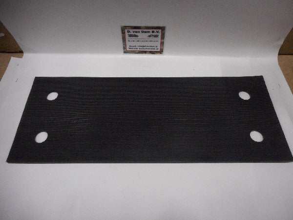 Accubak rubber mat with four circular holes. Accubak rubber mat with four circular holes.