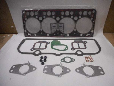 Koppakkingset with various gaskets and components laid out.