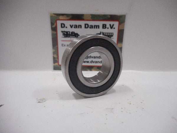 Toplager bearing with manufacturer's label in the background. Toplager bearing with manufacturer's label in the background.