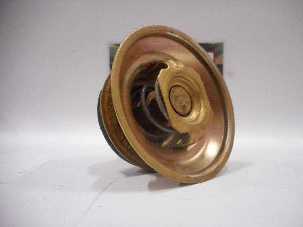Golden metallic thermostaat, part number NSN 6620-00-737-5211, shown against a plain backdrop.