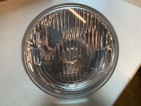Koplamp H4 vlak glas met stadslicht